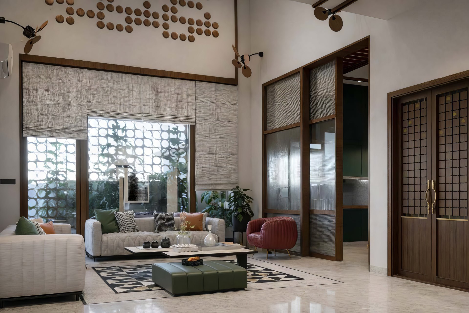 Project Terra — central living room with jaali screen and wood-disc art wall